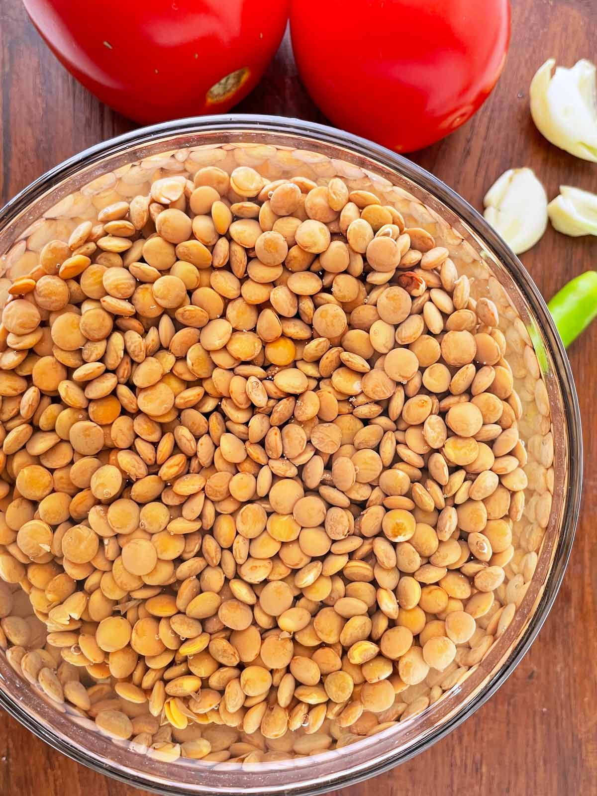 Bowl of lentils for Lentil Dahl Soup Recipe soaking in water.