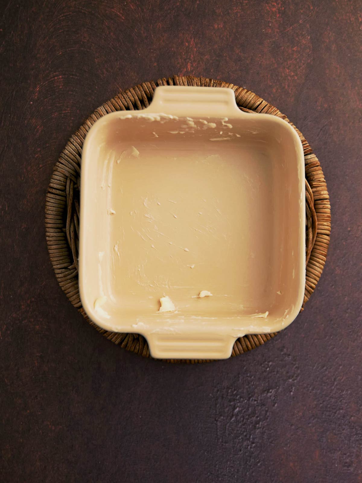 Baking sheet with butter spread on bottom and sides.