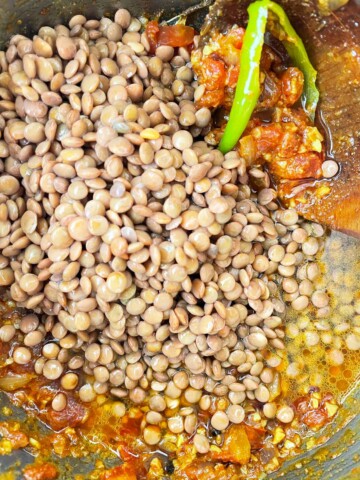 Soaked lentils are added to the pot.