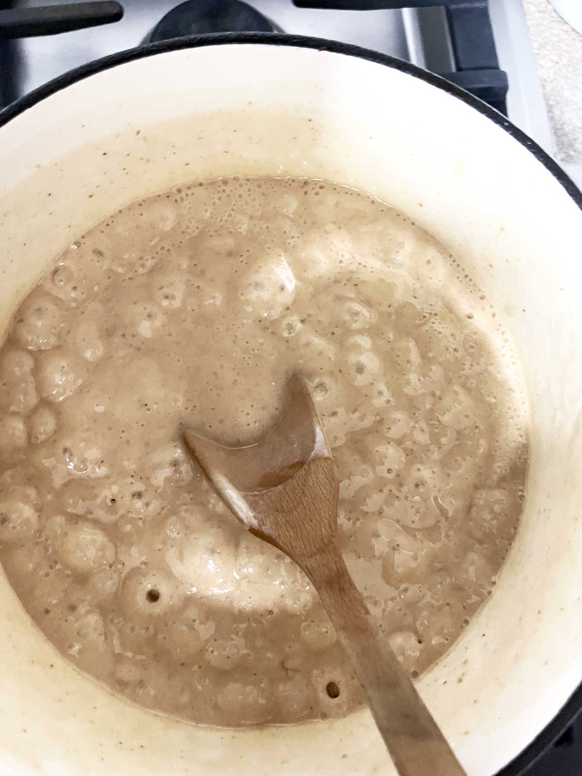 Fully cooked sugar mixture on stove bubbling.