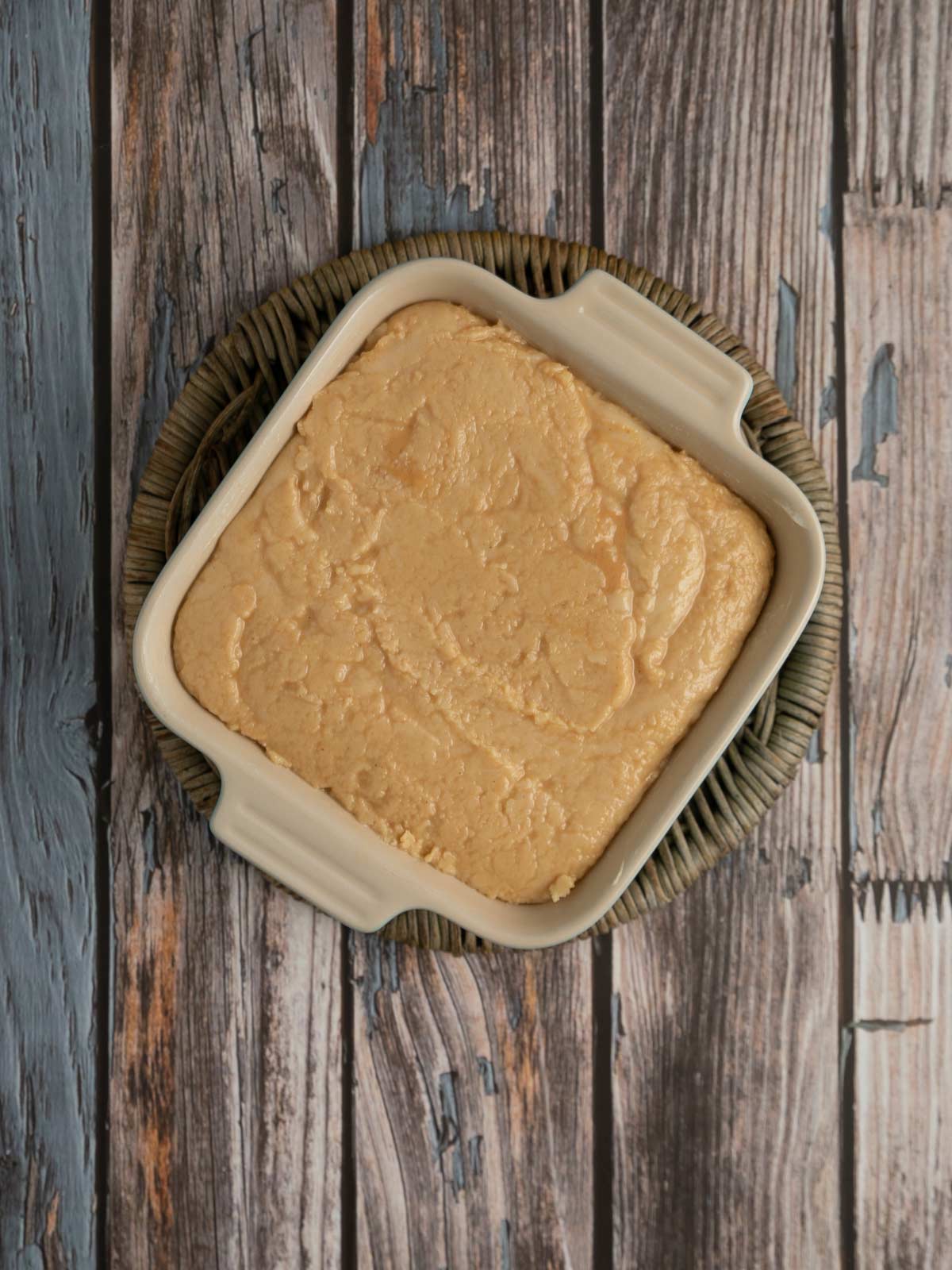 Peanut butter fudge poured into buttered pan.