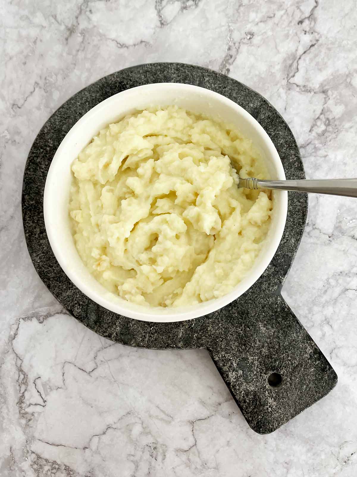 Prepared mashed potatoes in a bowl.