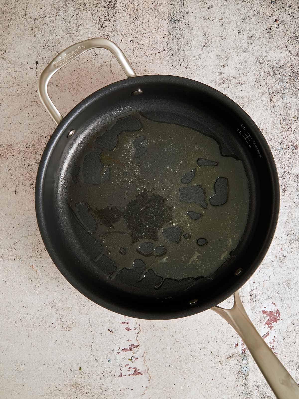 Large non-stick skillet with oil, butter, lemon juice.