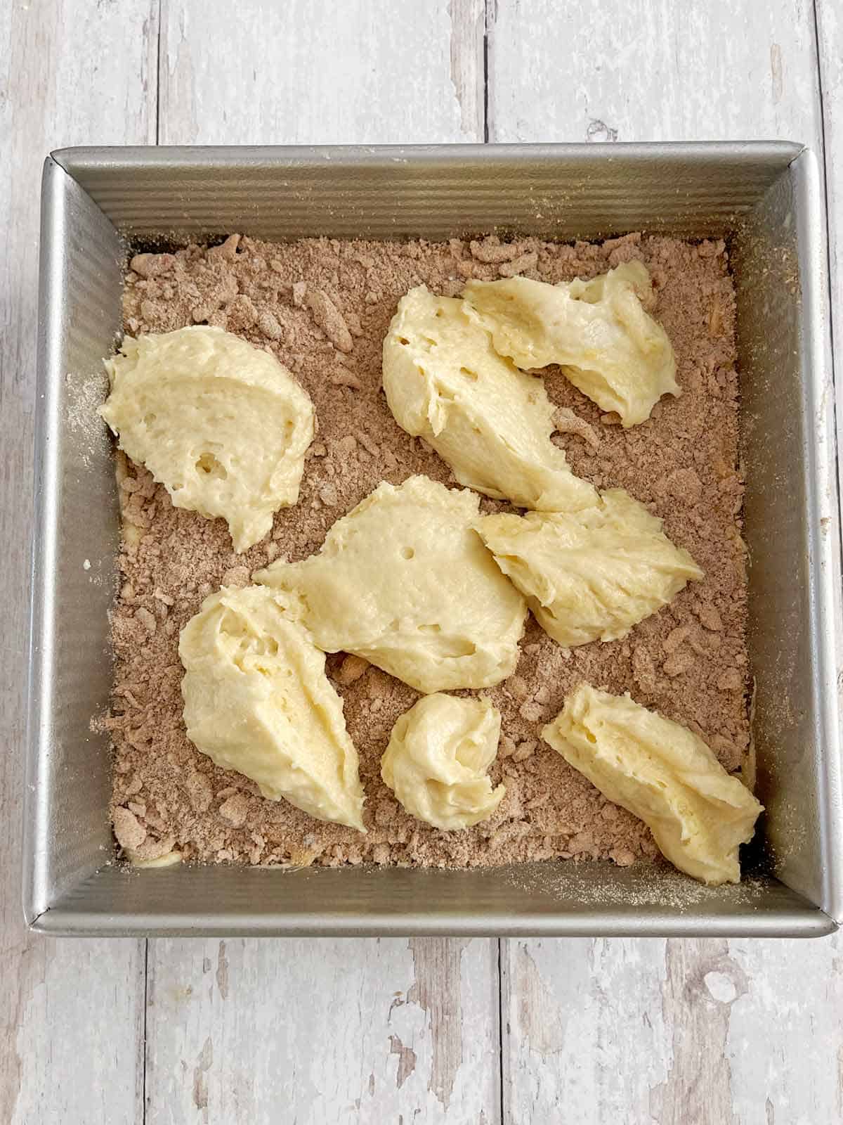 Second half of the batter dropped onto the streusel in large dollops.