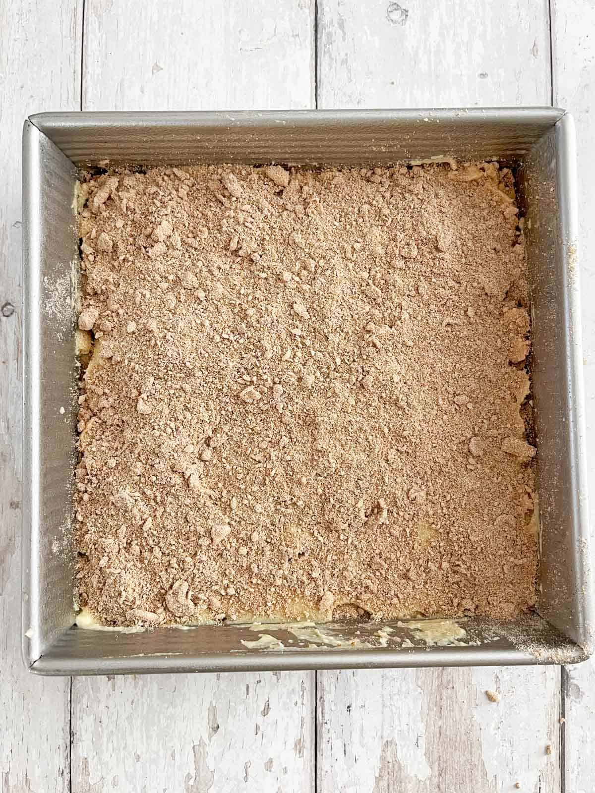 Second half of the streusel spread out over the top of the batter.
