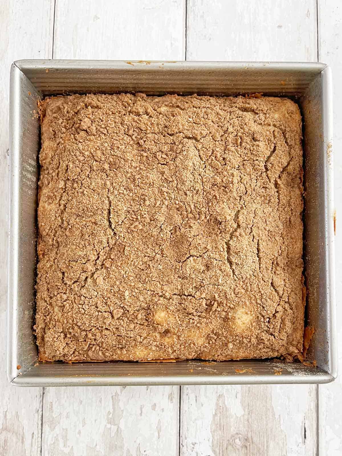 Fully baked coffee cake out of the oven and cooling before slicing.