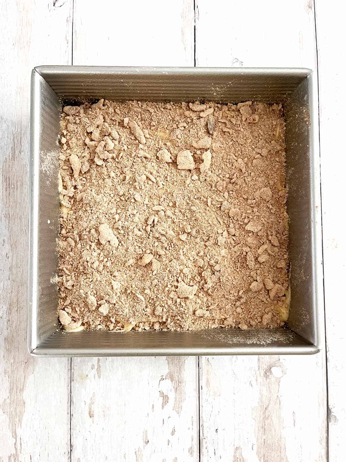 Streusel sprinkled evenly over the cake batter.