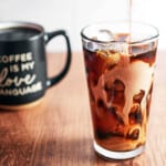 Lass of iced coffee with cream.