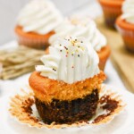 Double-decker brownie with cake top and frosting.