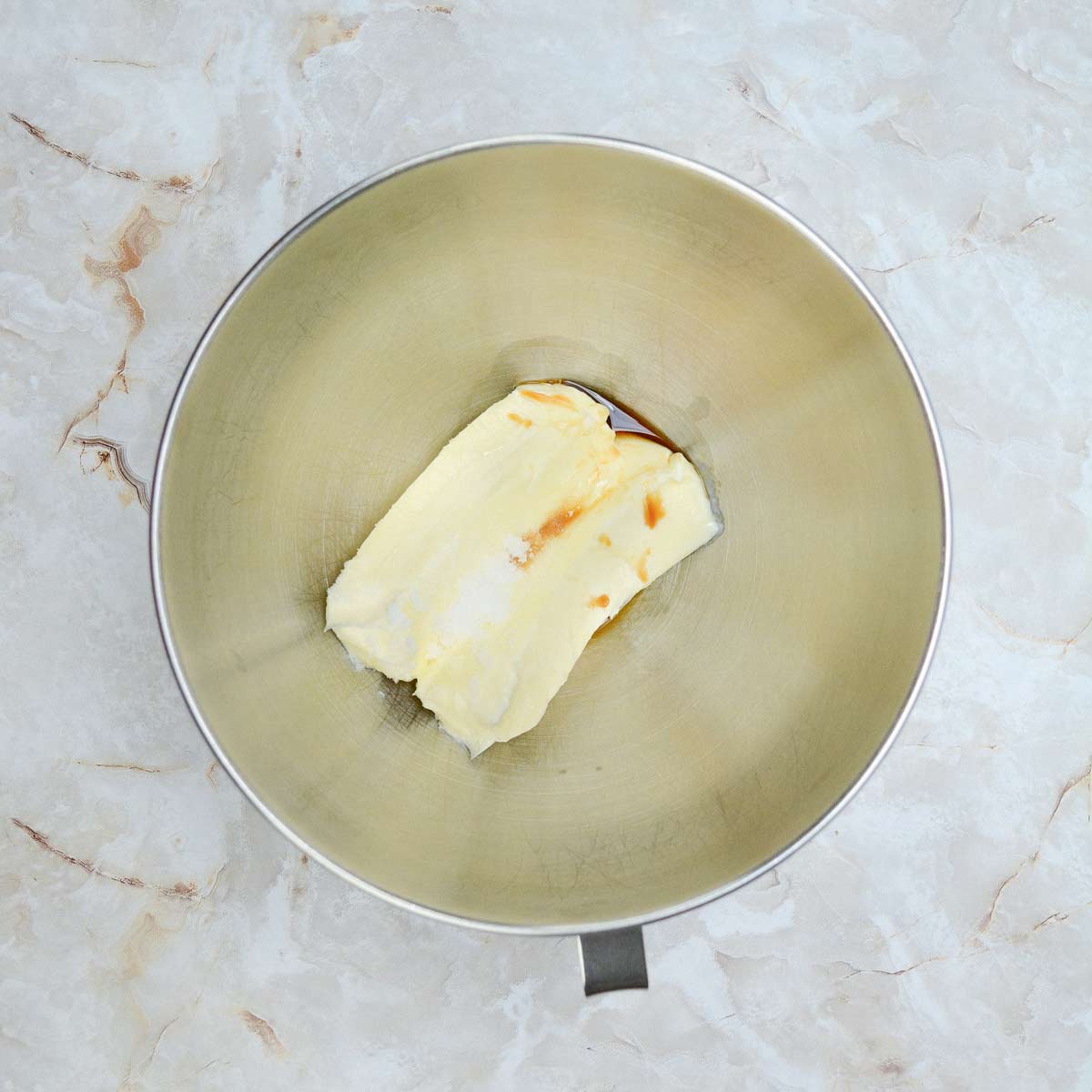 Butter and vanilla in mixing bowl.