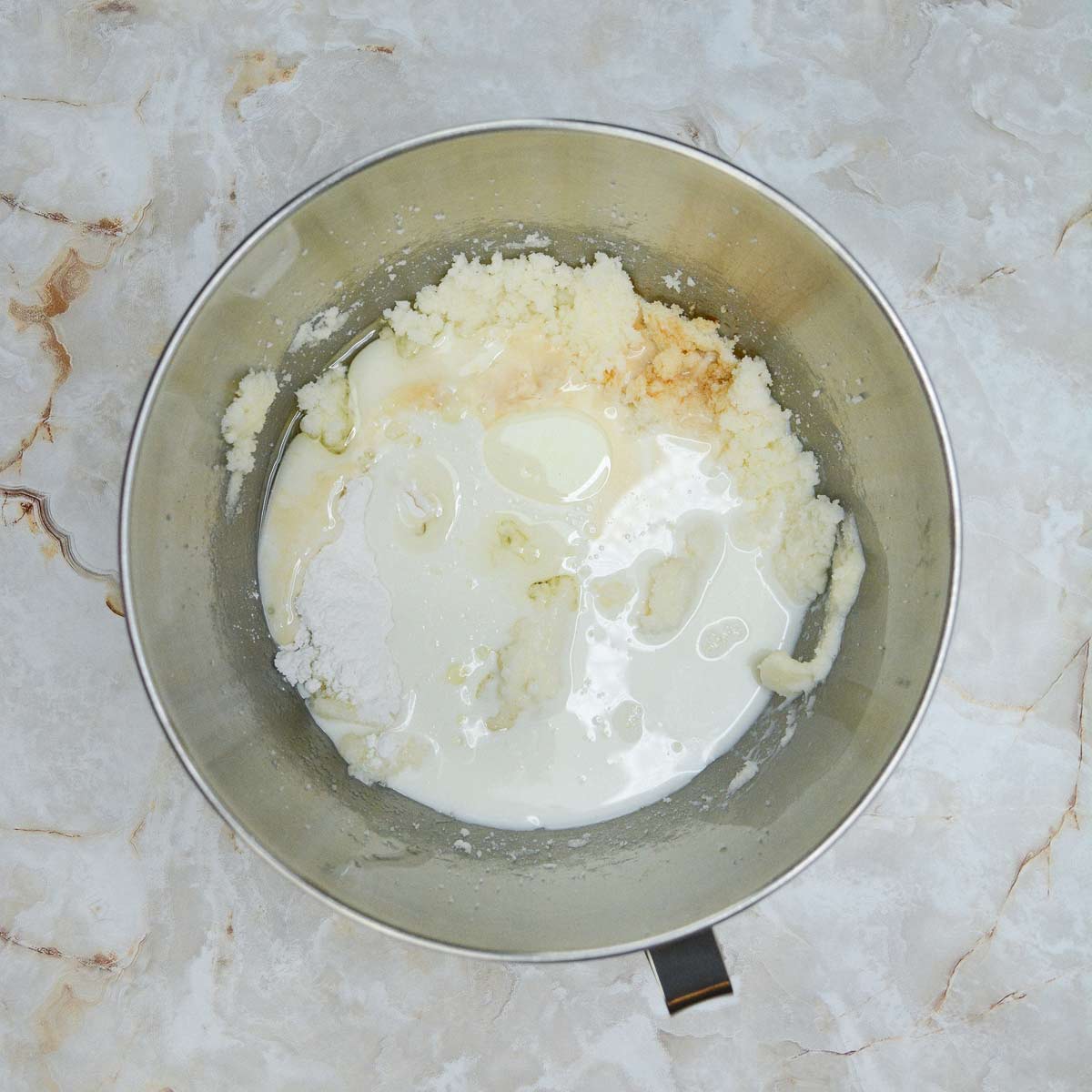 Milk, oil, egg whites, baking powder, salt, and vanilla added to the mixing bowl.