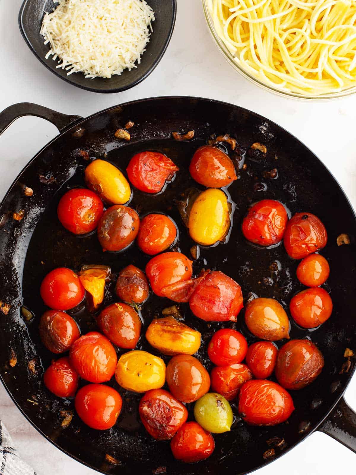 Skillet with cooked tomatoes.