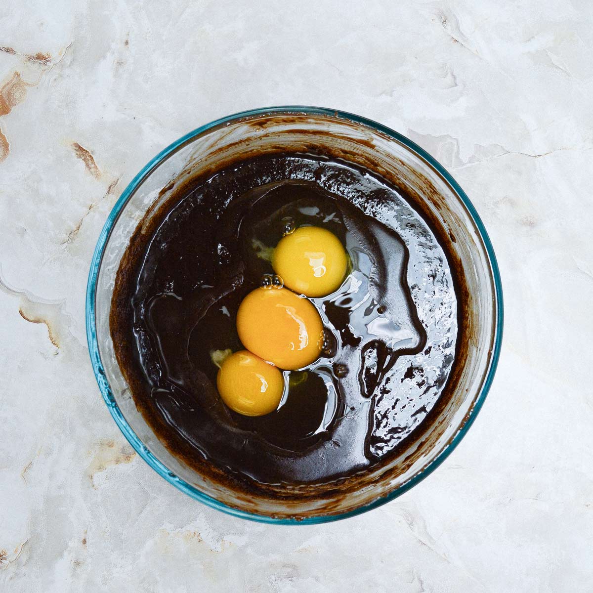 Brownie batter with eggs and yolk added.