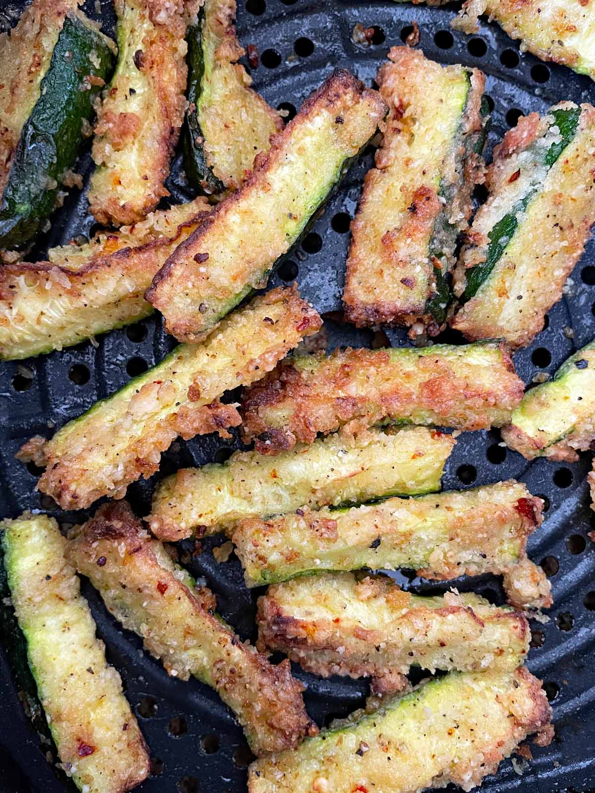 Fully cooked golden brown zucchini fries.
