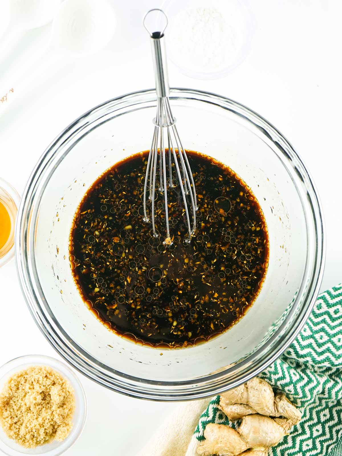 Whisking the teriyaki sauce.