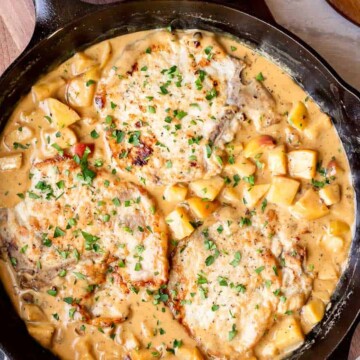 A cast iron skillet filled with apples and cheese.