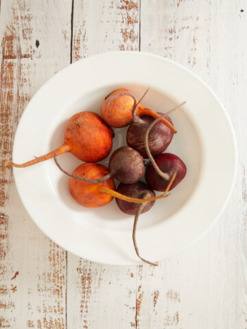Bowl of washed raw beets.