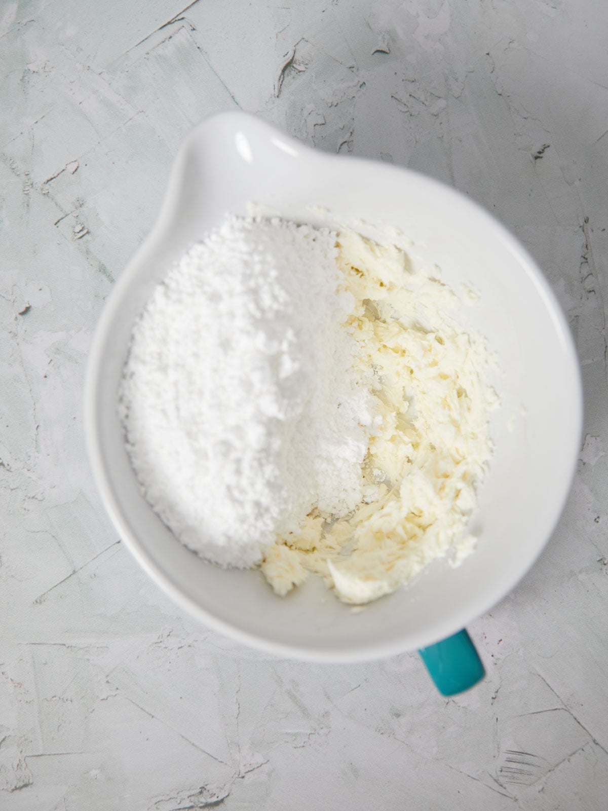 Mixing bowl with powdered sugar added.