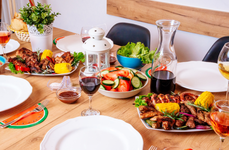 Beautiful table setting with grilled food. 