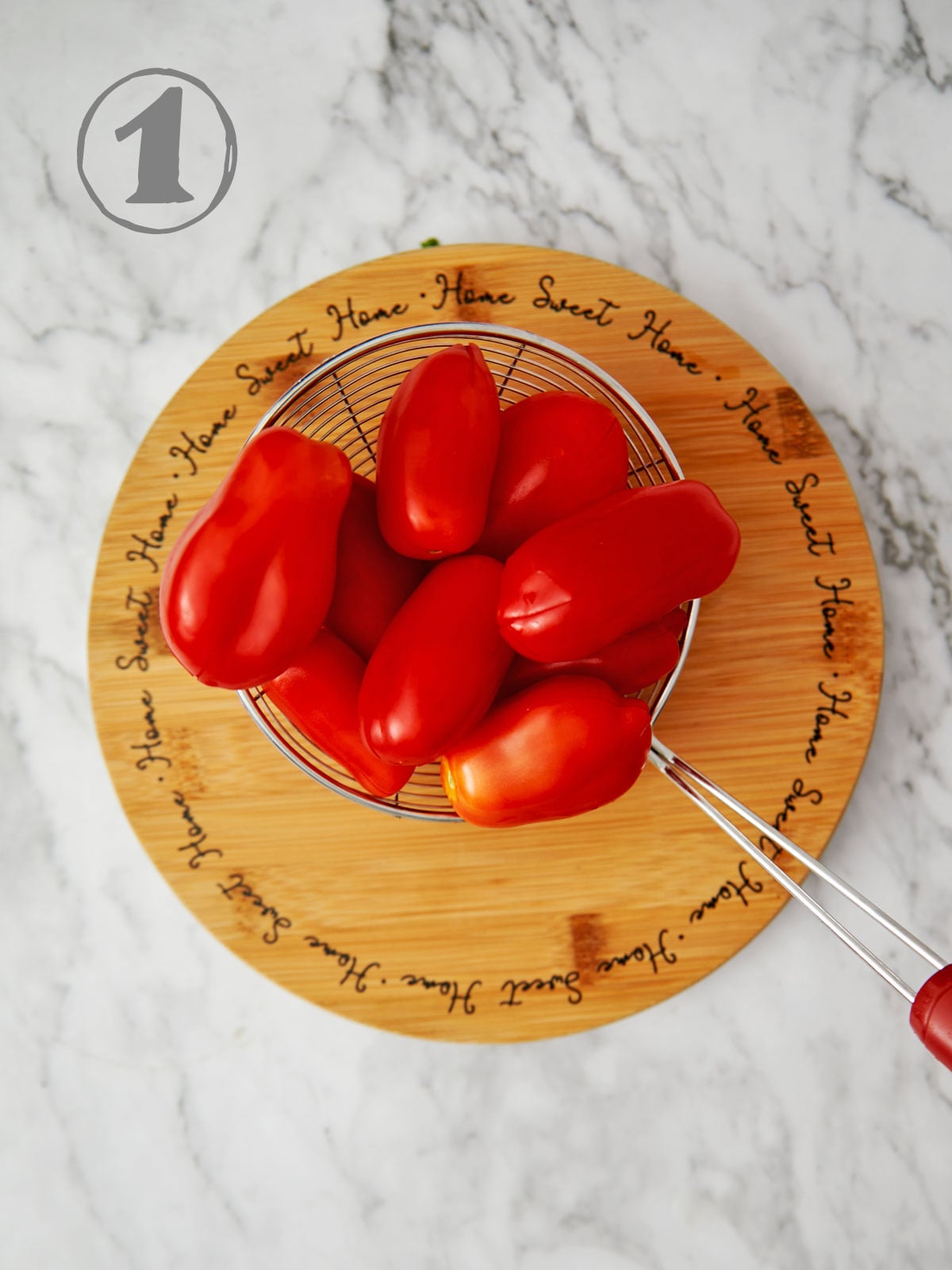 Tomatoes with an X cut on the bottom.
