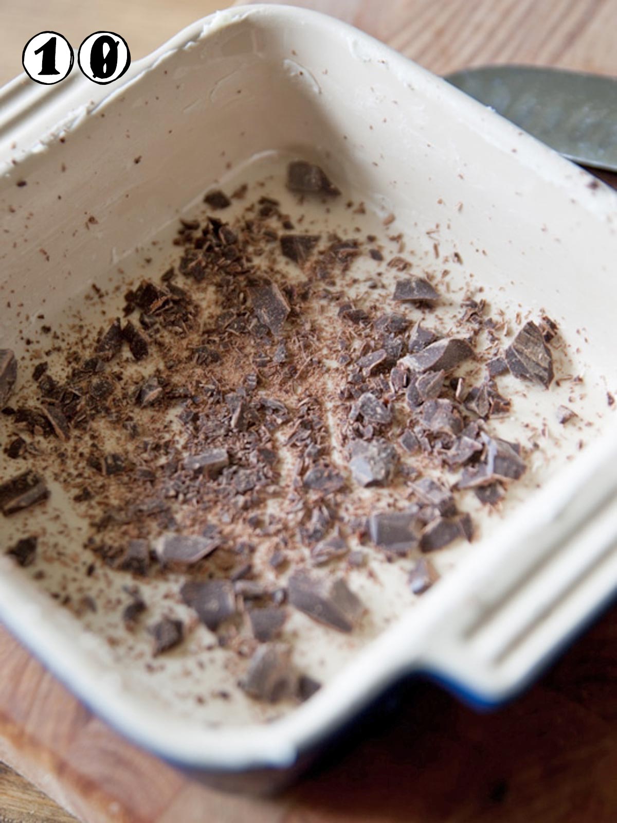 Chopped chocolate in the bottom of the greased baking pan.