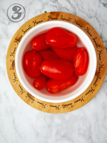 Blanched tomatoes in ice water.