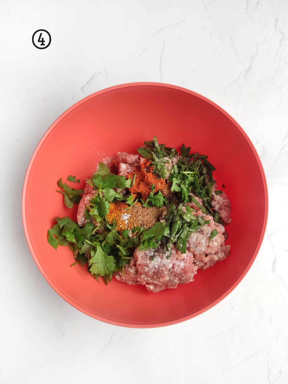 A bowl with meat and vegetables in it.