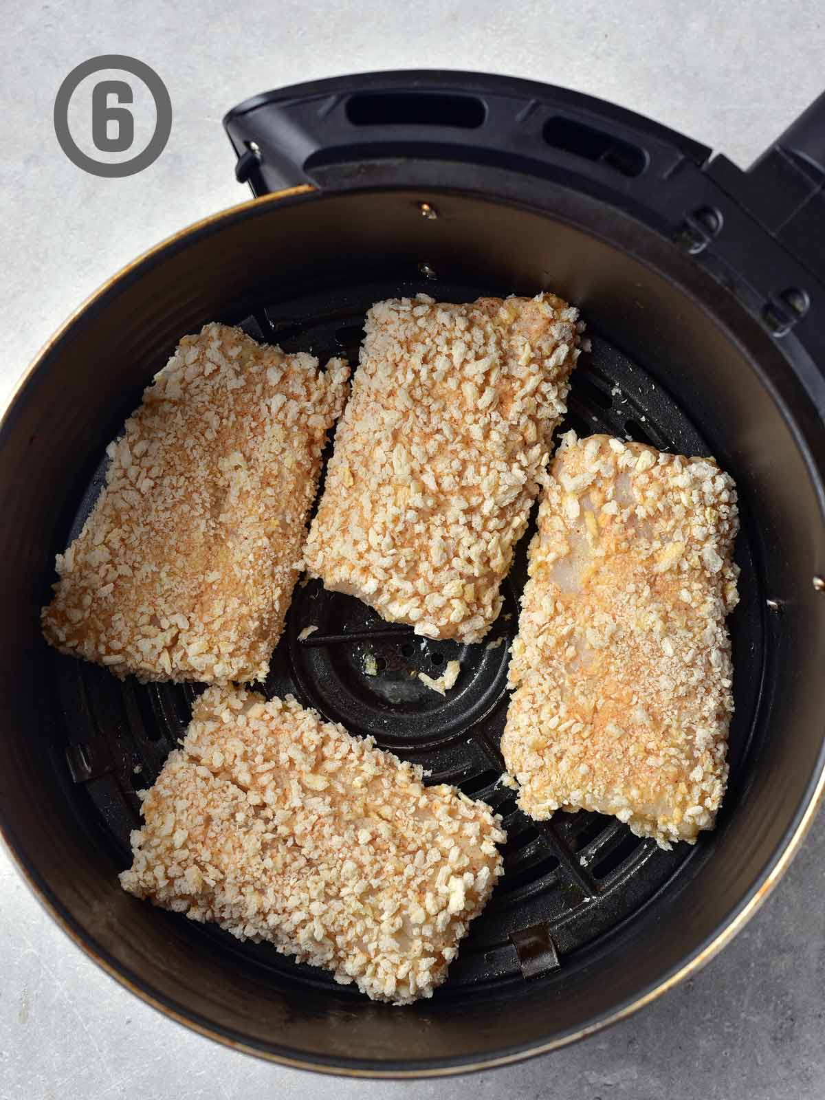 Breaded fish in an air fryer.