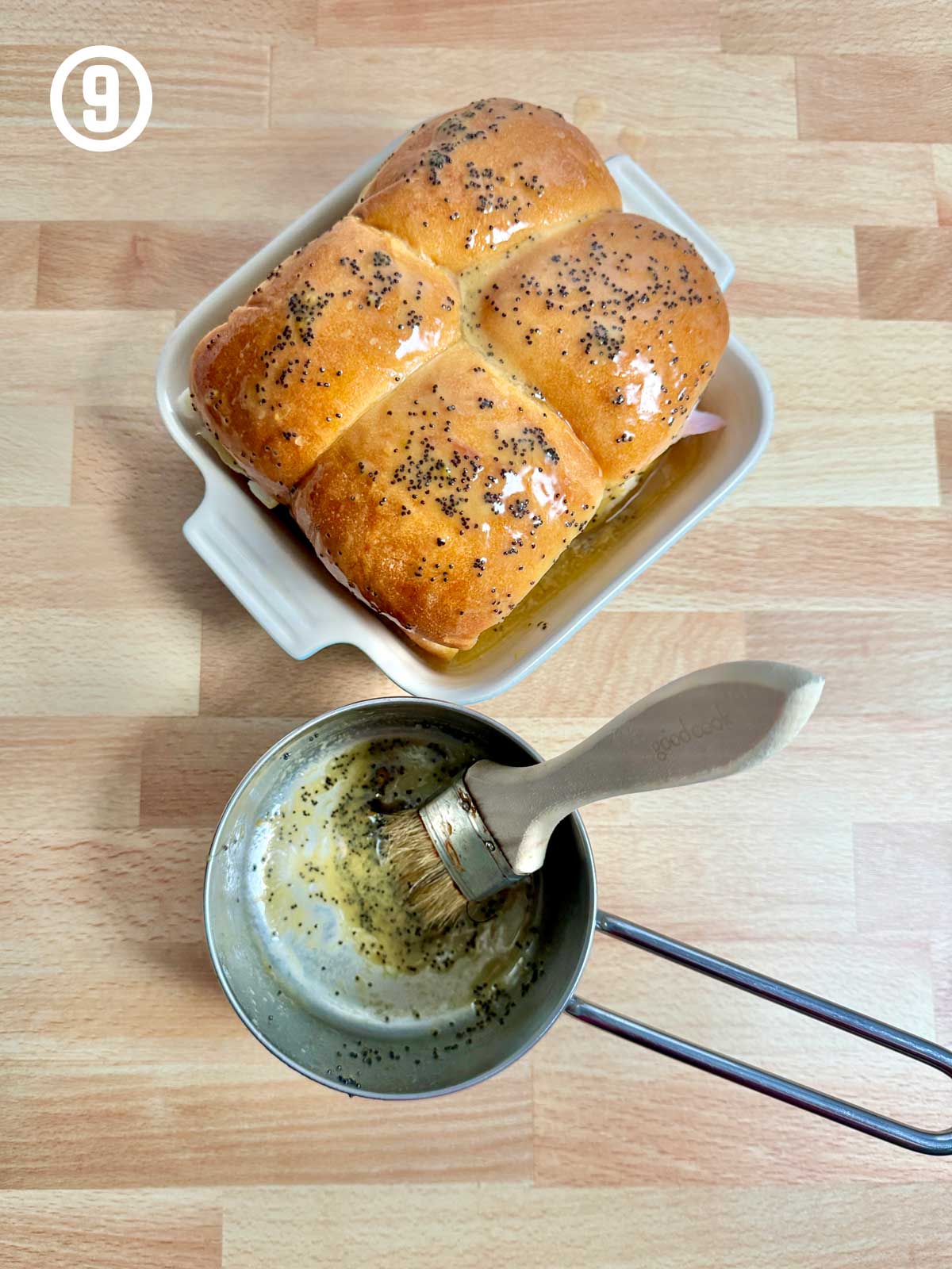 A pan with a loaf of bread and a spatula next to it.