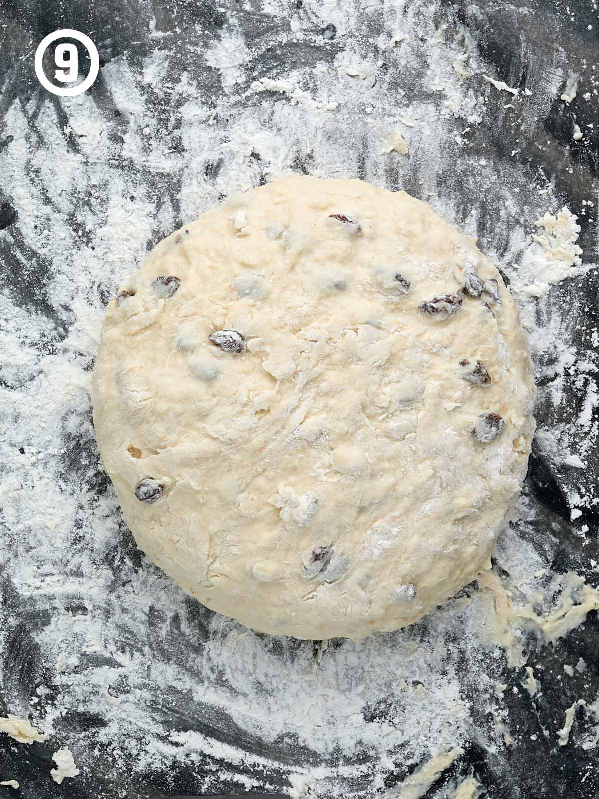 A ball of dough with flour on top of it.