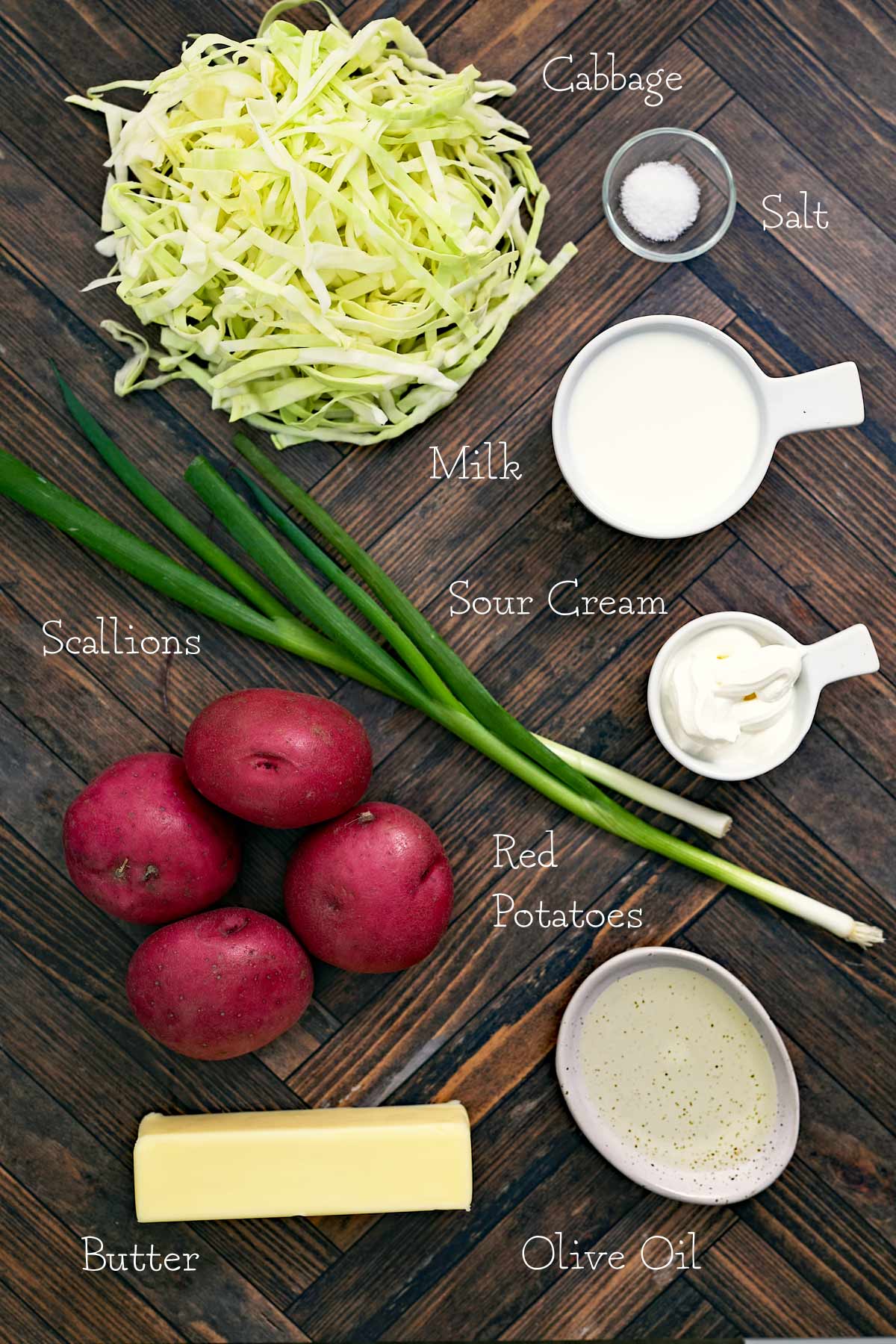 Irish colcannon ingredients for cabbage slaw on a wooden table.