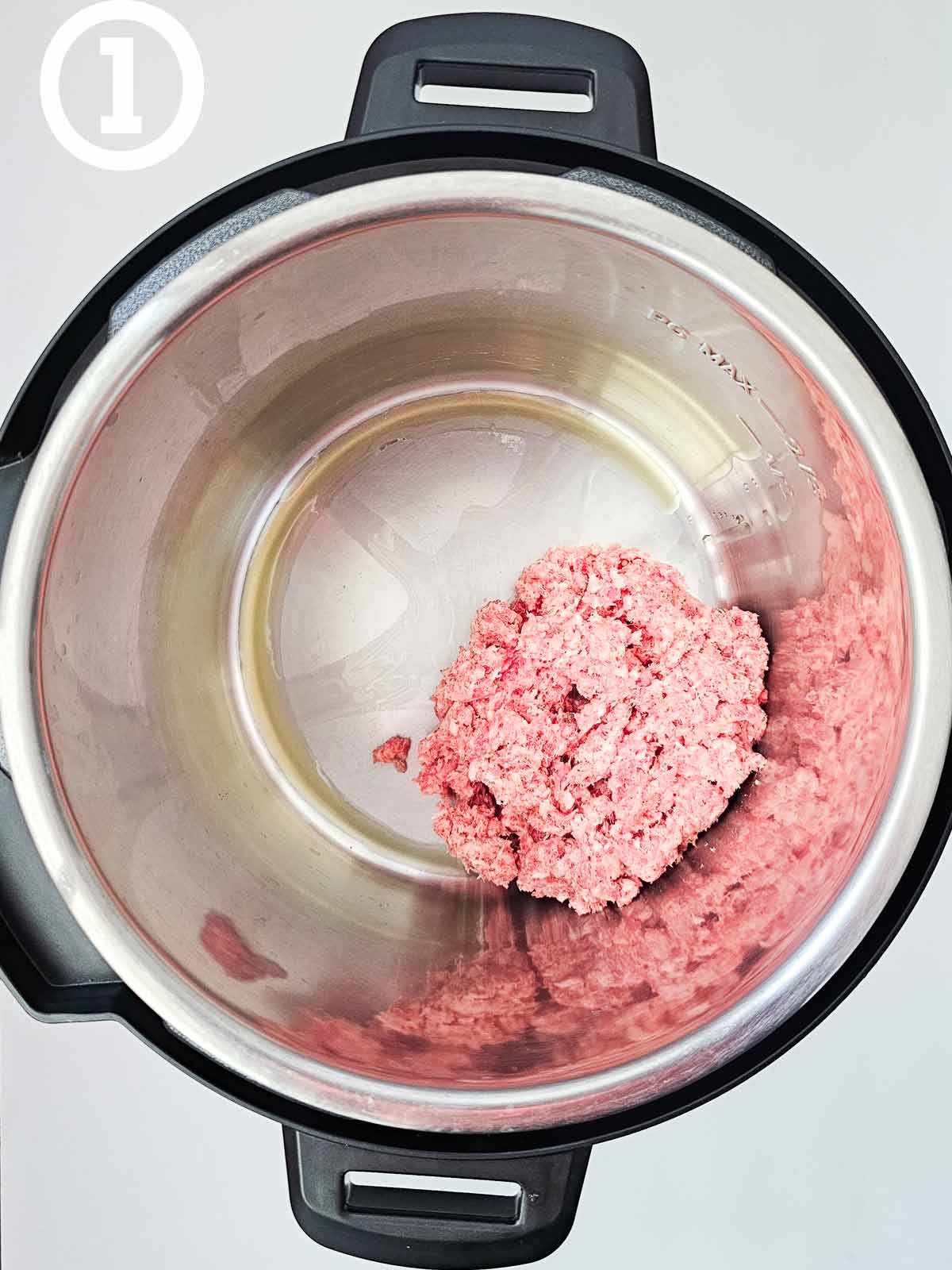 An instant pot with meat in it.