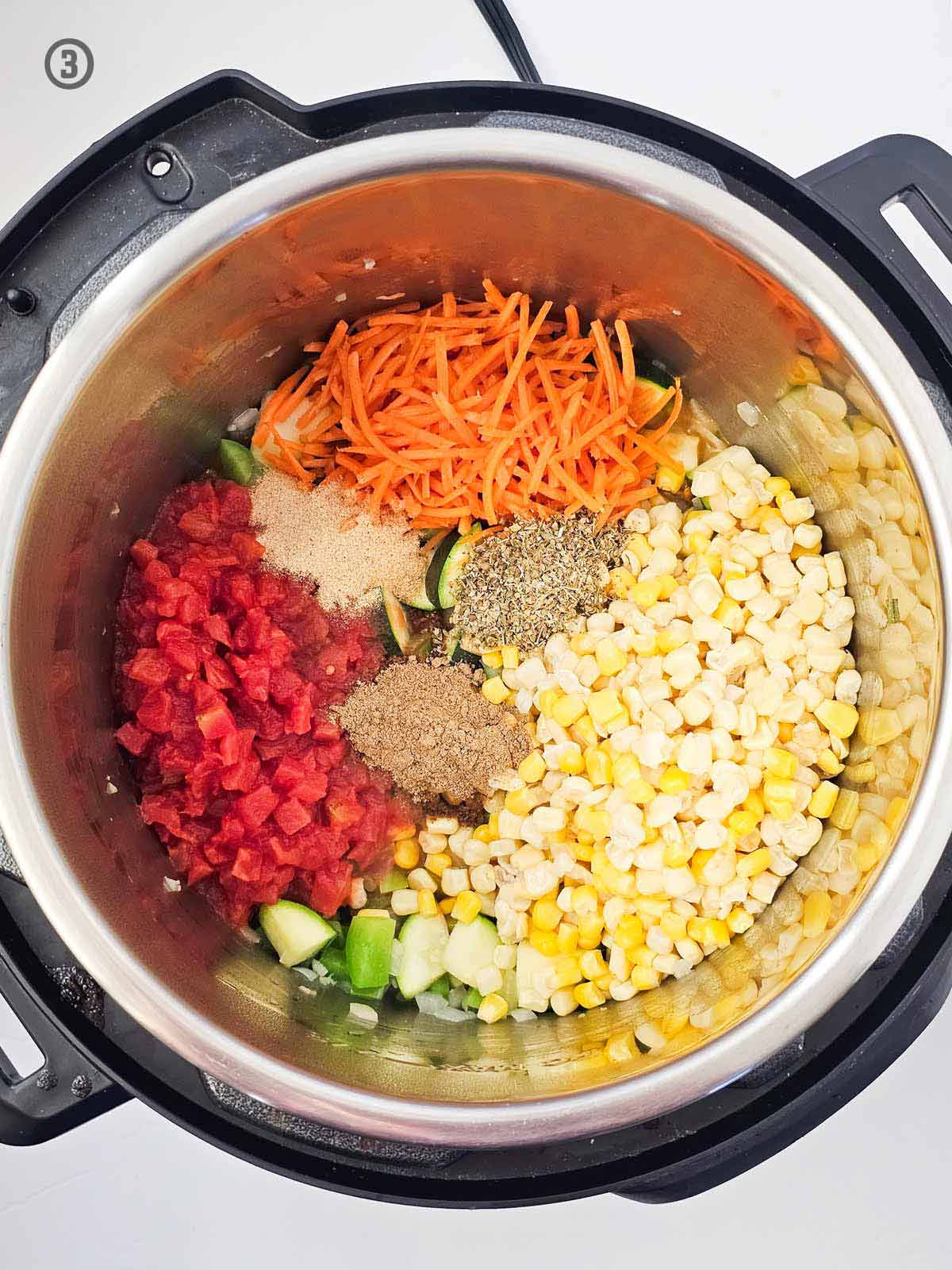 An instant pot filled with Mexican Vegetable Soup ingredients.