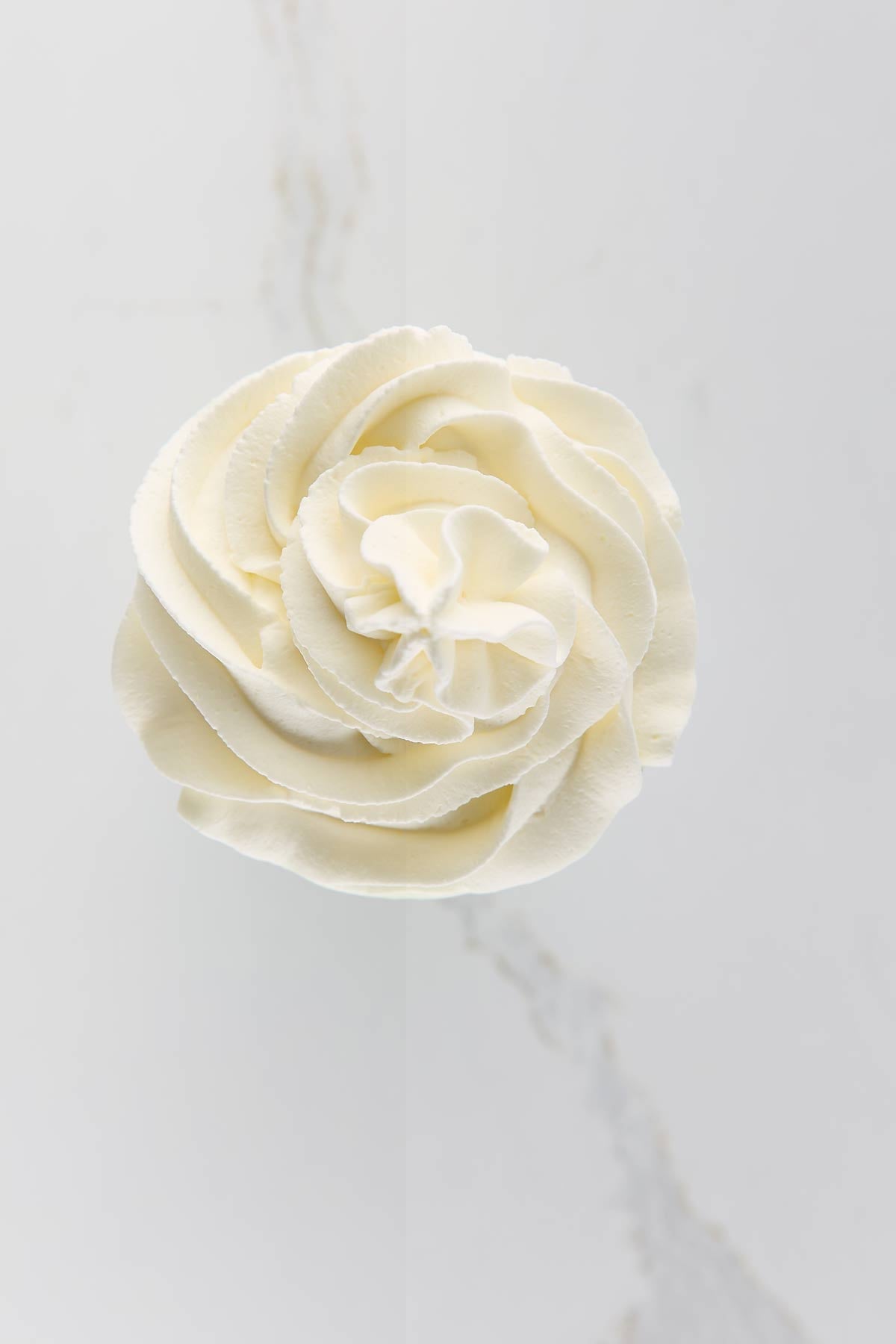 Top of a milkshake with whipped cream on top.